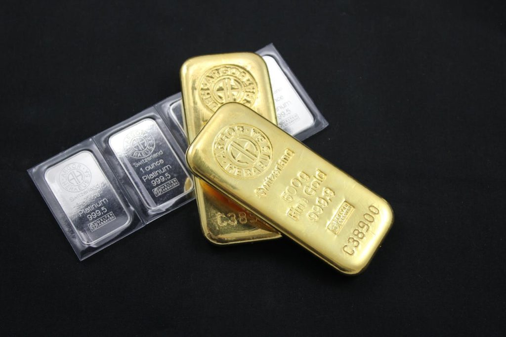 Close-up of gold and platinum bars depicting wealth and investment potential.